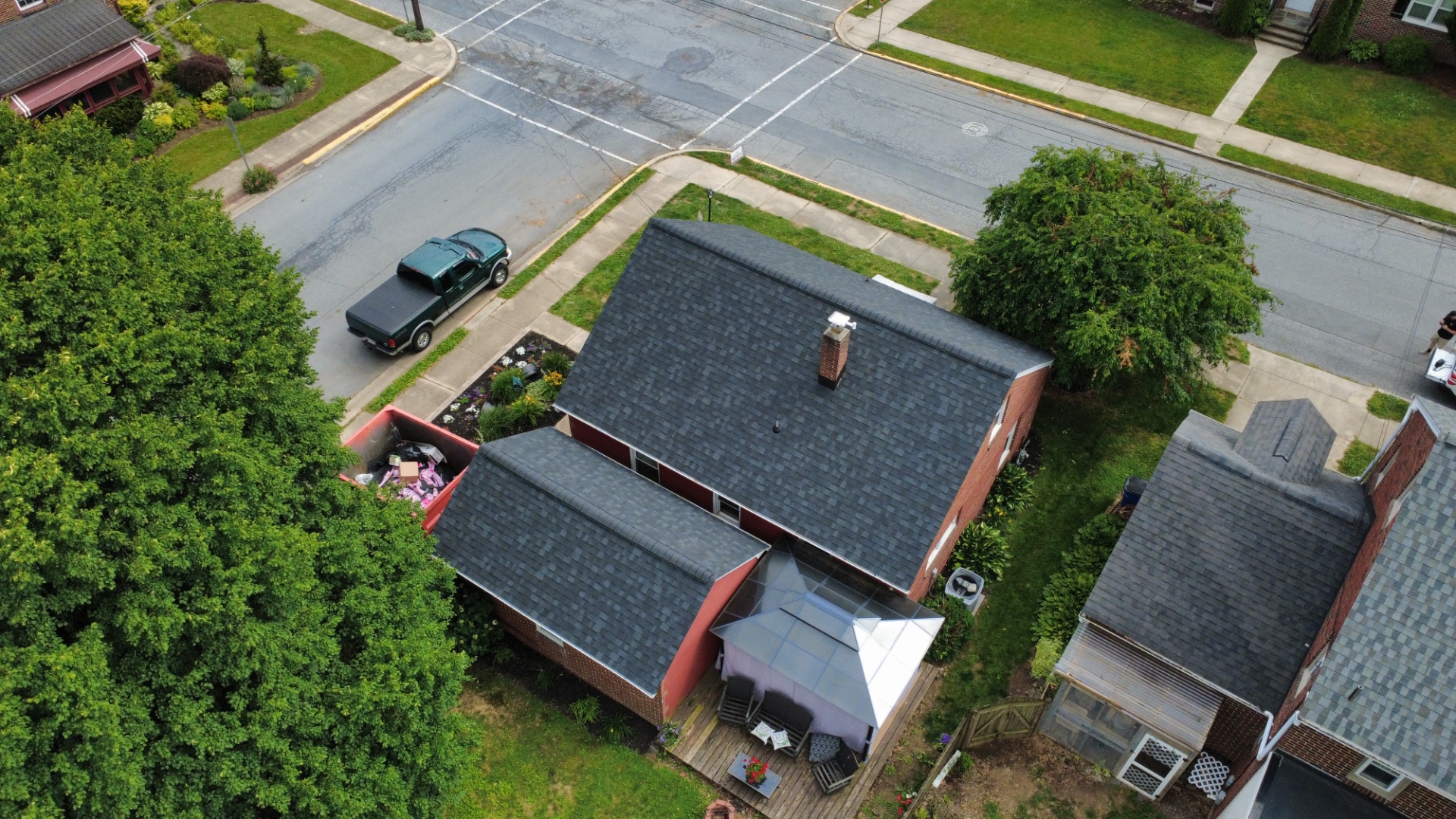 Second aerial view of completed roofing project